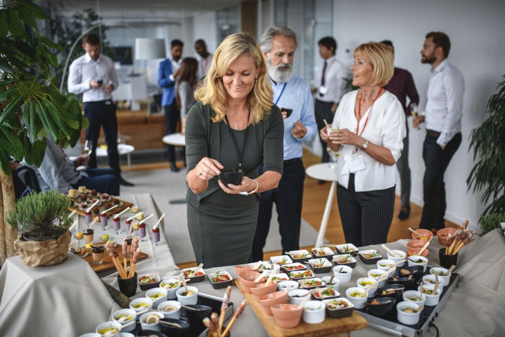 business people networking around food